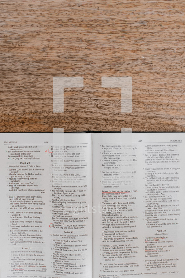 open Bible on a wooden desk