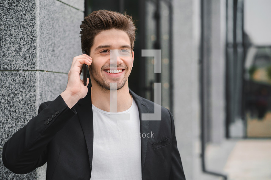 Businessman have serious conversation using cell phone. Business guy in formal suit talks intently with colleague. Office employee, wage worker, weekdays concept.