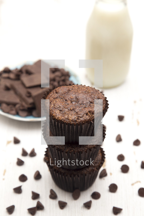 Whole Wheat Double Chocolate Chip Muffins Isolated on a White Background and milk 
