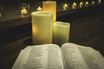 open Bible and candles 