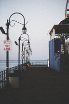 fire lane sign and street lamps on a pier 