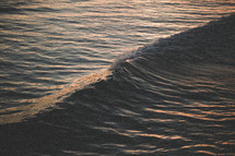 waves in the ocean at sunset 