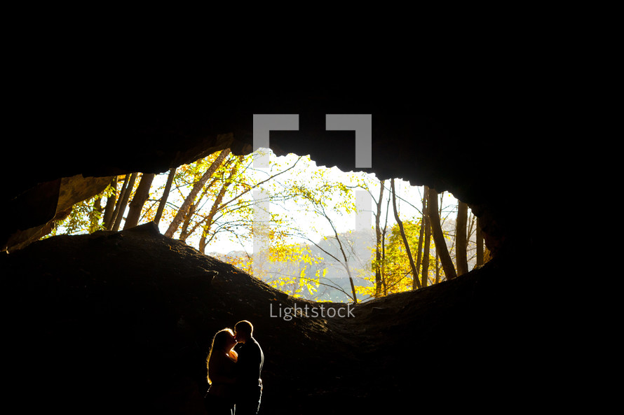 couple kissing in a cave 