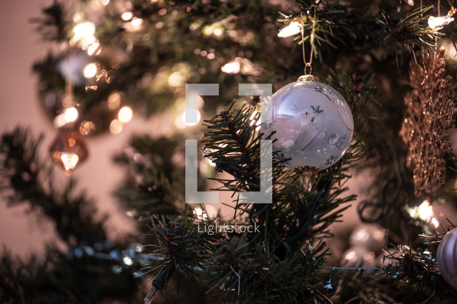 bokeh Christmas lights and ornaments on a Christmas tree 