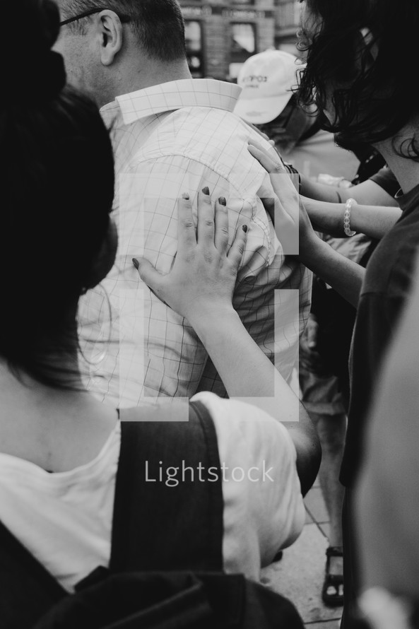 Touching hands of prayers