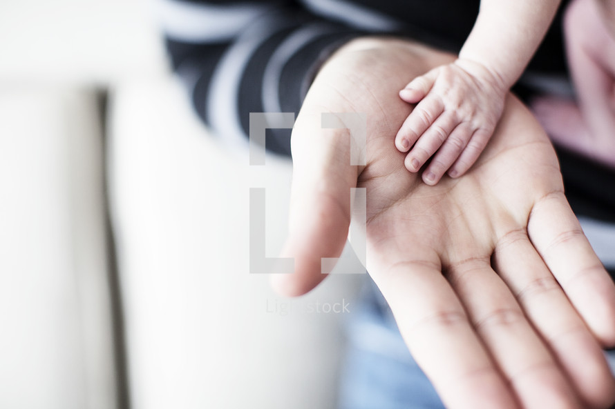 Parent and child hands.