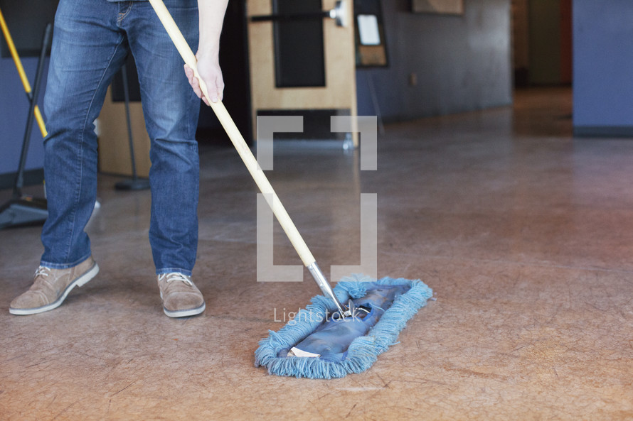 janitor mopping a floor 