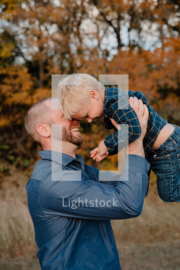 portrait of a father and son outdoors in fall 