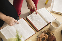 pointing to scripture at a Bible study 