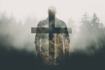 Silhouette of a man on a cross in the forest.
