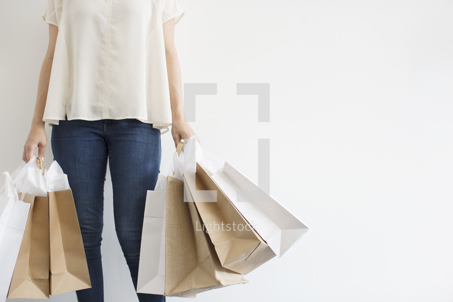 a woman holding shopping bags 