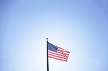 American flag blowing in the wind.