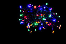 Colorful christmas lights. Shiny leds isolated on black background