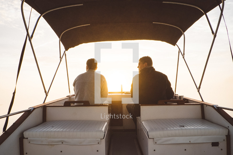 men steering a boat 
