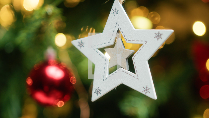 Star decoration adorning a Christmas tree
