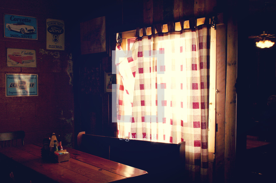 sunlight through curtains on a window