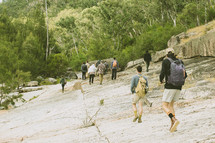 a group backpacking outdoors 