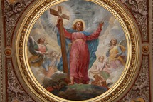 painting of Jesus holding a cross