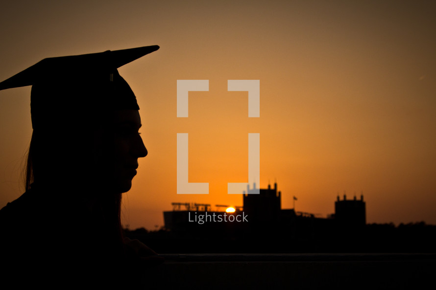 silhouette of a female graduate 