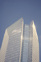 top of a skyscraper against a blue sky 