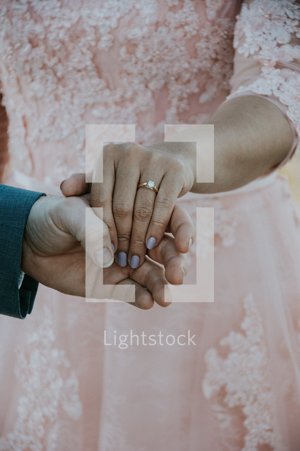 bride and grooms hands 