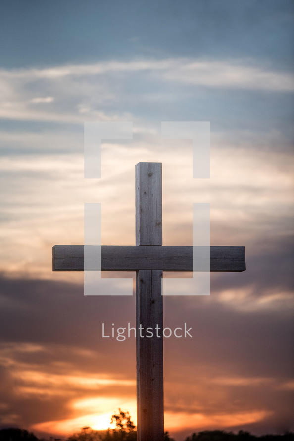 cross against a fiery sky 