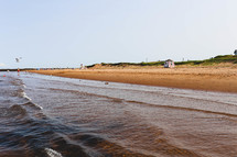 tide washing onto a beach shore 