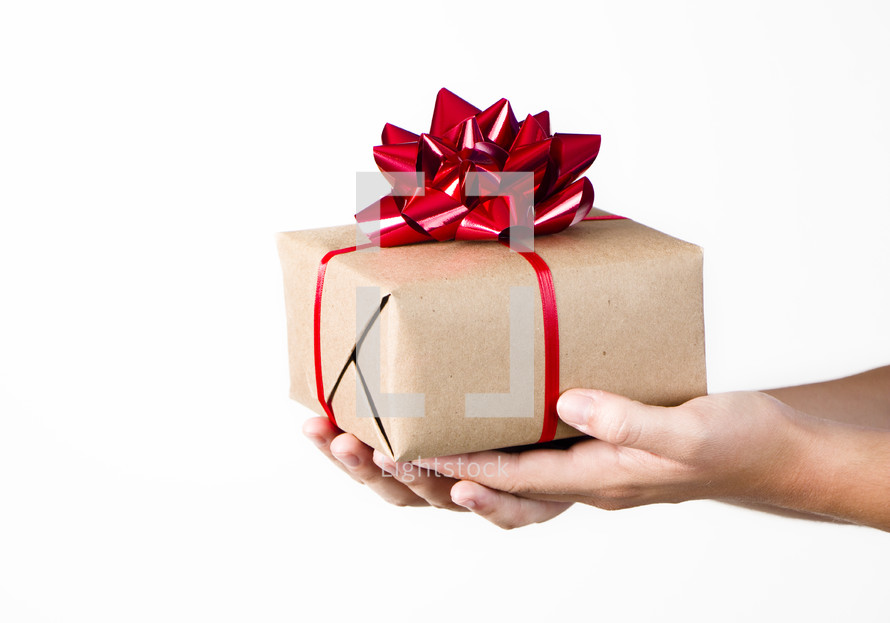 A person holding out a gift on a white background