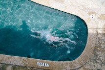 person swimming in a pool 