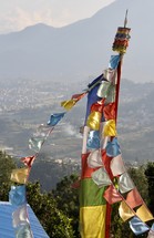 colorful banners hanging on a pole 