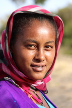 Ethiopian woman wearing a traditional head scarf 