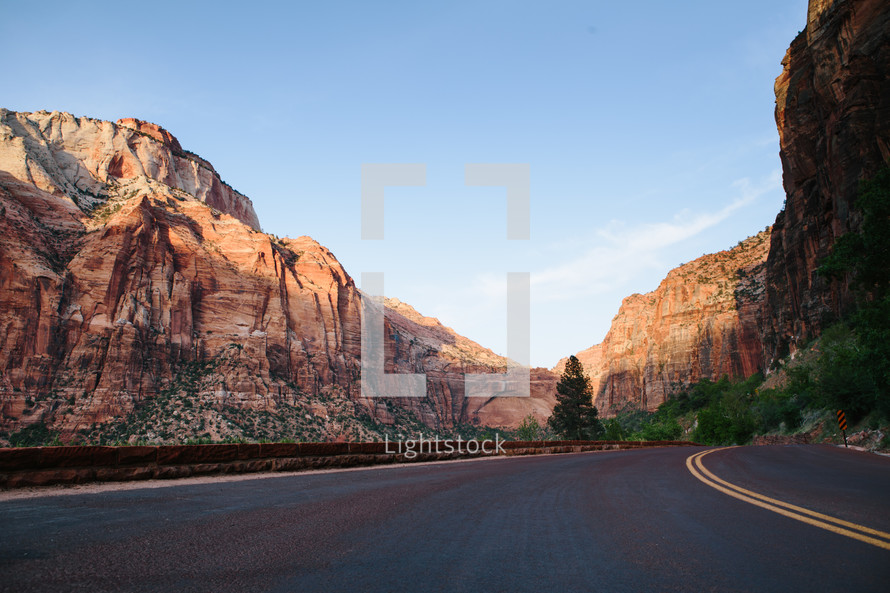 A highway through rocky mountains.