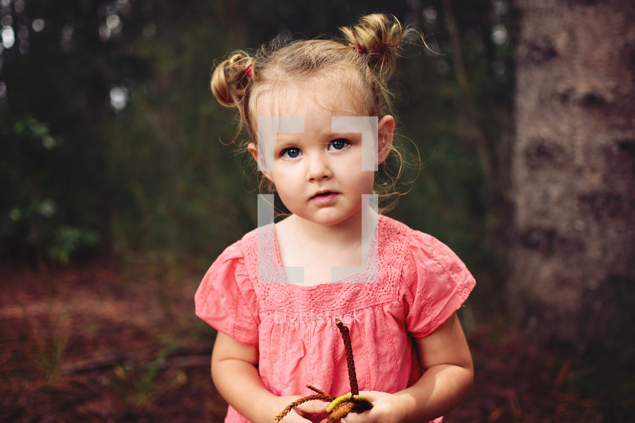 portrait of a toddler girl outdoors 