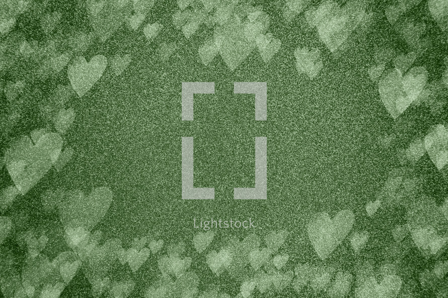 green background with bokeh hearts 