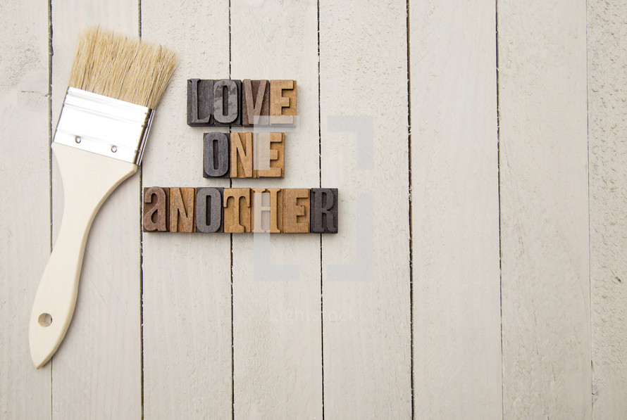 Love one another with paint brush 