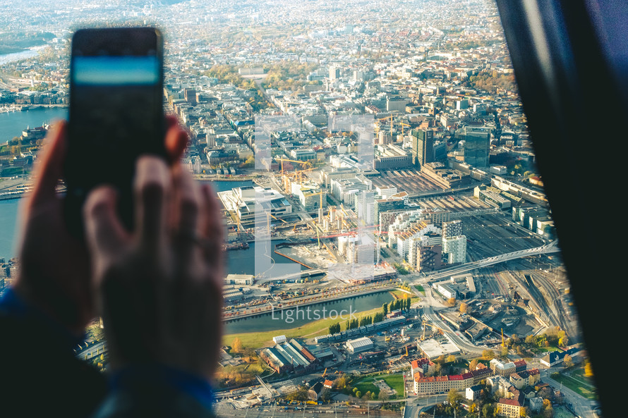 taking a picture out of a helicopter window 