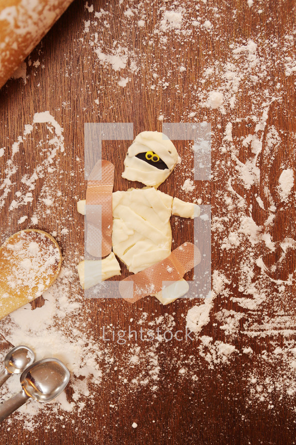 broken mummy cookie mended with band-aids.