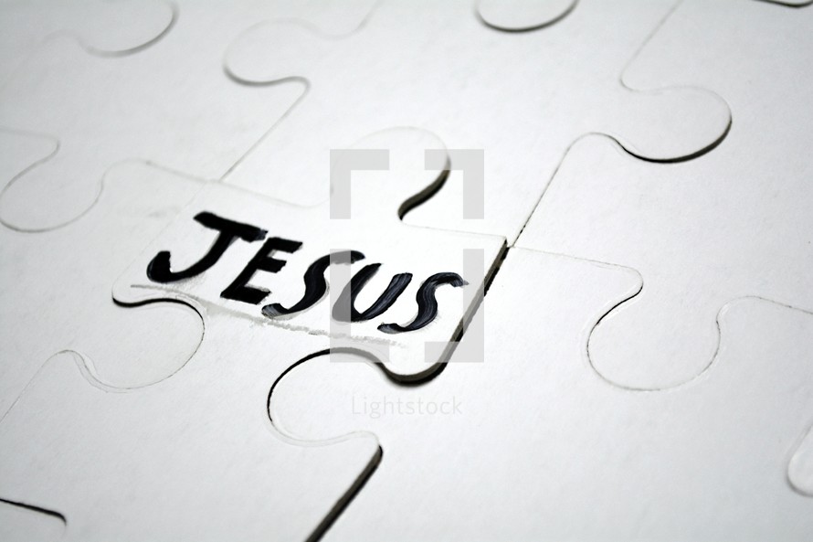 word Jesus on a puzzle piece 