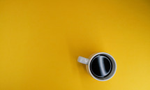 Coffe and mug on a yellow background