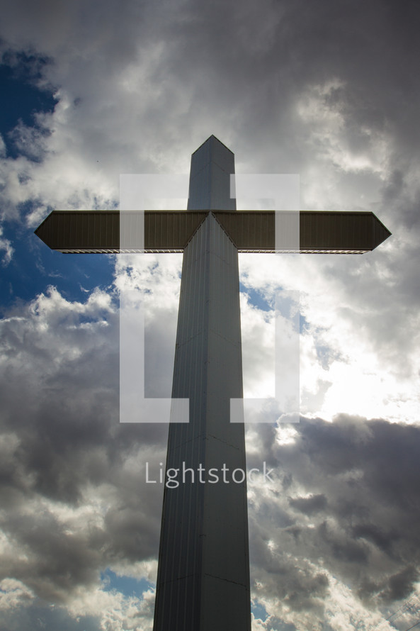 cross and clouds in the sky 