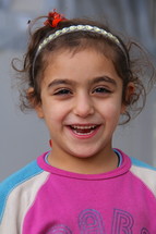 Smiling young Chaldean Iraqi refugee girl [For similar search Ethnic Face Smile] 