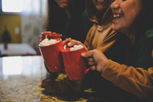 cheers with hot cocoa 