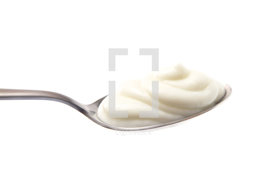 Spoon Full of Yogurt on a White Background