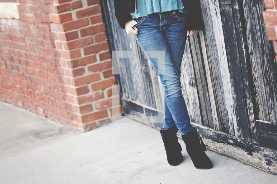legs of a young woman in jeans 