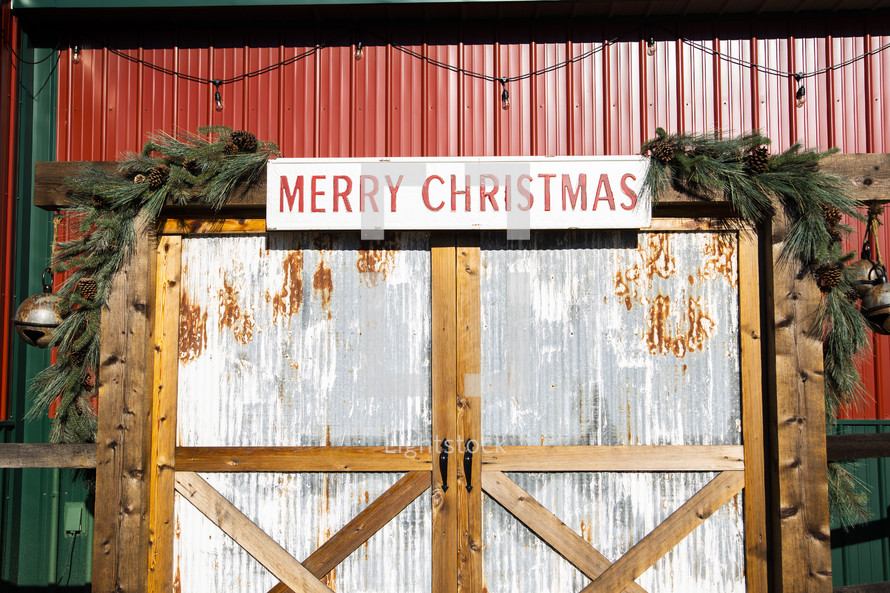 Red and green barn with rustic Christmas decor