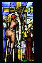 The descent of Christ from the cross stained glass window 