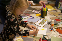 Child working on Christmas crafts
