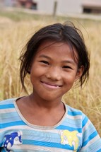 face of a smiling girl child in Nepal 