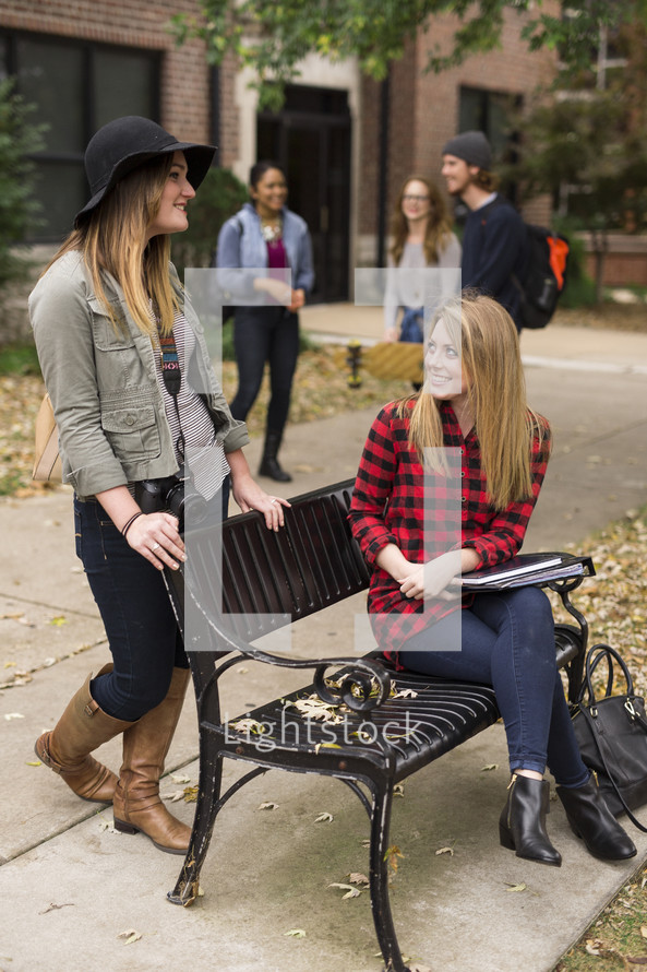 students talking on campus