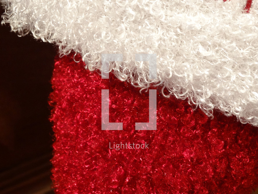 Soft curly plush texture of a Christmas stocking